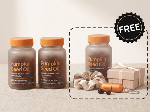 Two bottles of pumpkin seed oil softgels, and marked FREE: a third bottle, a silk scrunchie, an on-the-go softgel case and a mystery gift